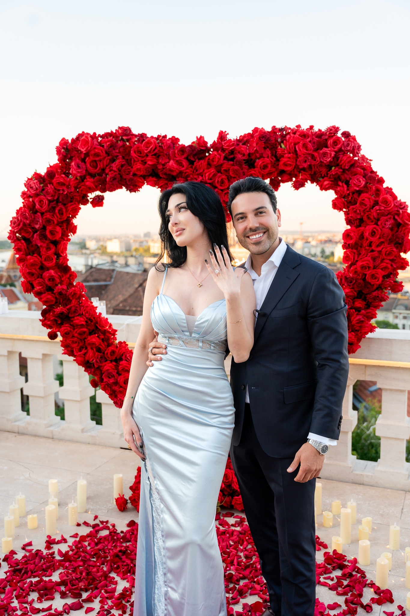 Engaged couple on a luxury rooftop in Budapest after fine dining at an elite restaurant {{brizy_dc_image_alt imageSrc=