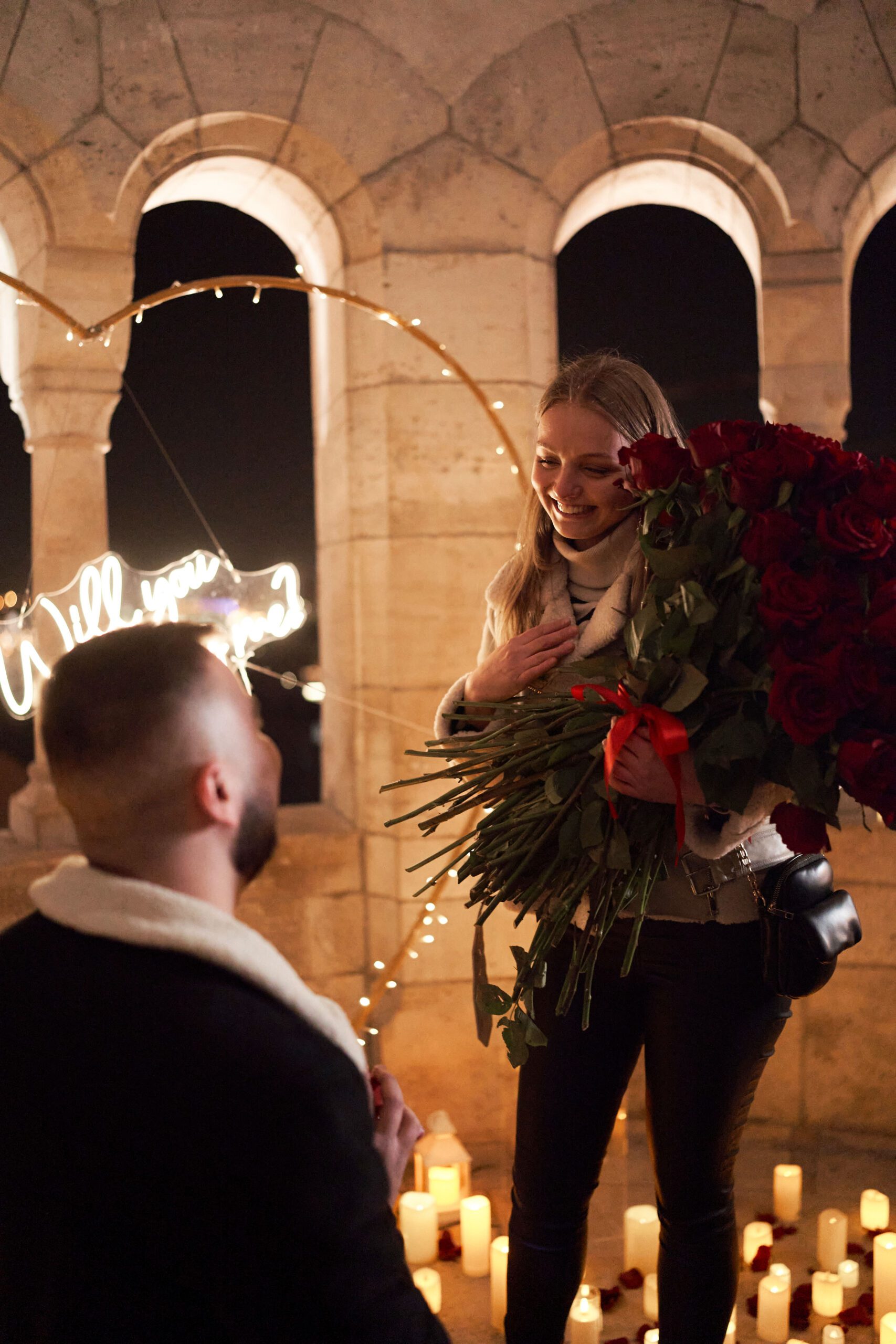 Surprise romantic wedding proposal with red roses and candles in Hungary {{brizy_dc_image_alt imageSrc=