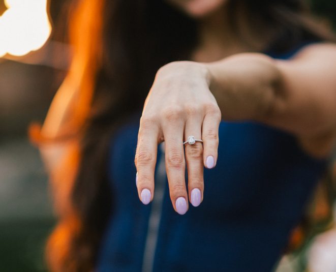 Close-up of a woman's hand showcasing an engagement ring after a proposal at Margaret Island.