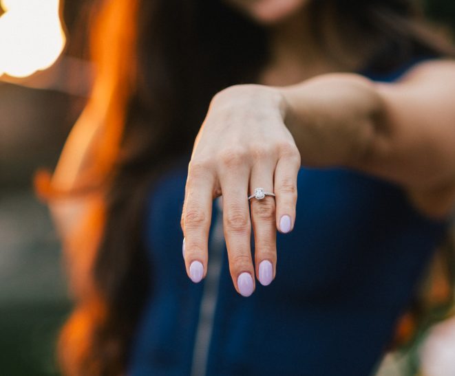 Close-up of a woman's hand showcasing an engagement ring after a proposal at Margaret Island. {{brizy_dc_image_alt imageSrc=