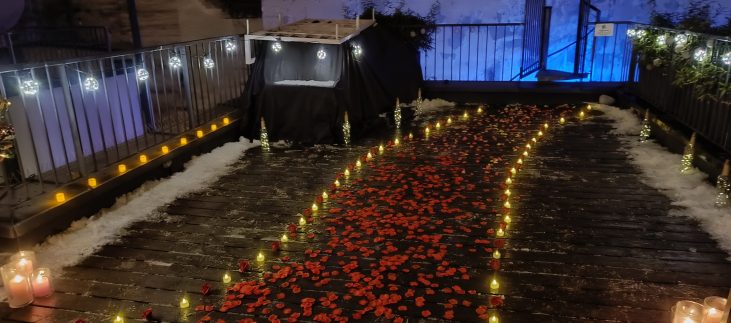 Romantic_Rooftop_Engagement_in_Budapest_with_Candles_and_Rose_Petals_Under_Starlight